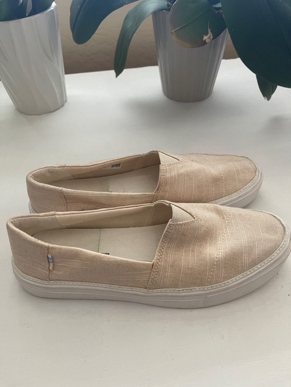 Toms Slip-On Flats in Beige Canvas perfect for going shopping at home.